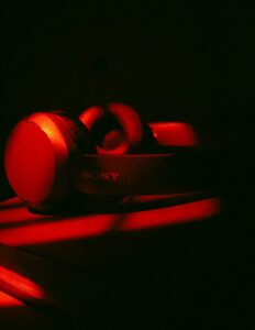 Sony headphones illuminated by red light